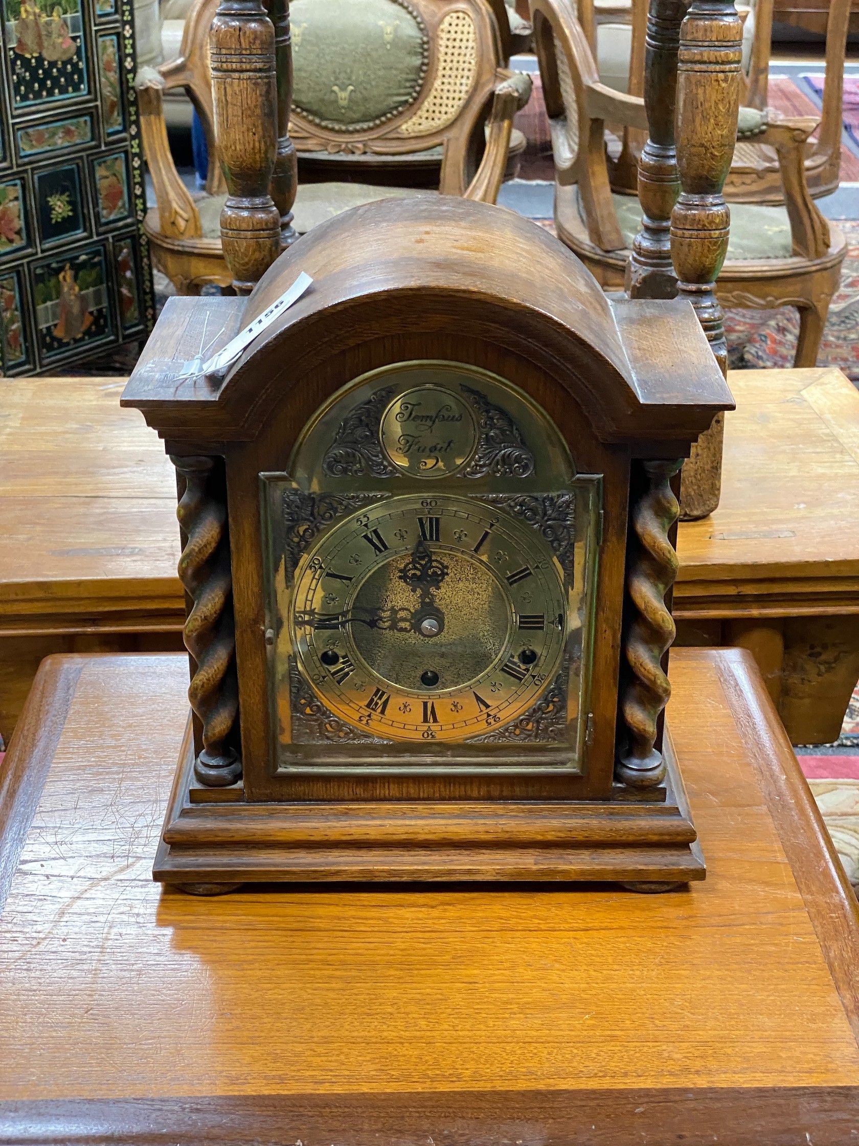 An early 20th century oak 8 day mantel clock, width 30cm, height 35cm